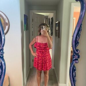 New romper with tags. Hot pink floral spaghetti straps